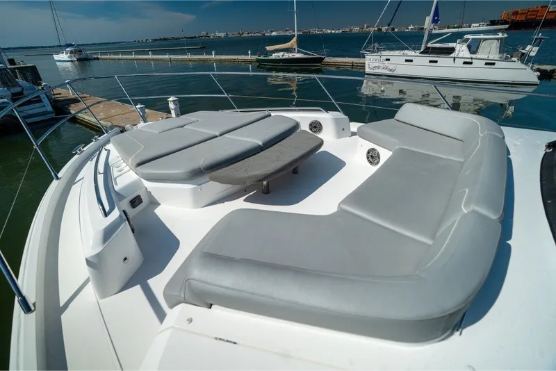 Slide: The Image of Luxurious 2021 Princess S66 yacht with spacious deck seating and scenic marina view. - 39