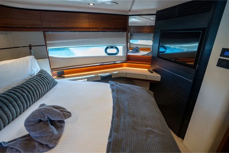 Slide: The Image of Luxurious 2021 Princess S66 yacht bedroom with modern decor and elegant lighting. - 30