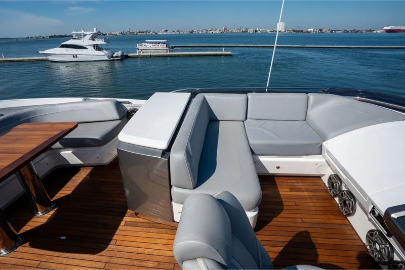 Slide: The Image of Luxurious 2021 Princess S66 yacht deck with elegant seating and scenic ocean view. - 36
