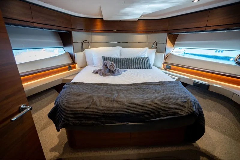 Slide: The Image of Luxurious bedroom interior of 2021 Princess S66 yacht with elegant wood finishes. - 29