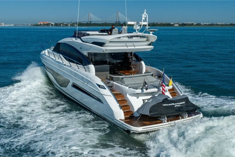 Slide: The Image of Luxury 2021 Princess S66 yacht cruising on open water, rear view. - 14