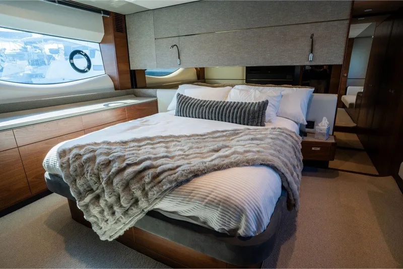 Slide: The Image of Luxurious bedroom interior of 2021 Princess S66 yacht with elegant bedding and wood accents. - 3