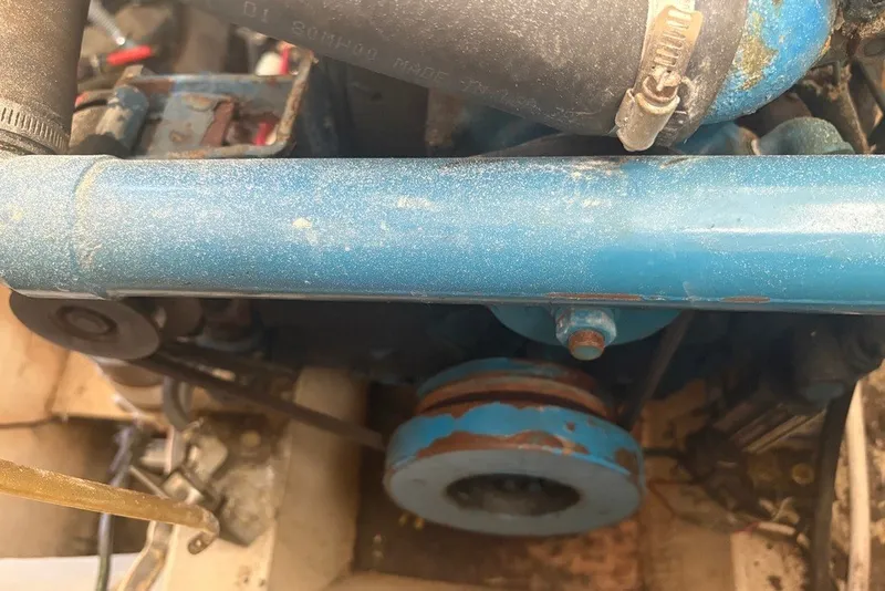Slide: The Image of Engine compartment of a 1975 Gulfstar 43 Trawler, featuring a blue-painted engine component. - 108