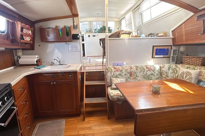Slide: The Image of Interior of a 1975 Gulfstar 43 Trawler with cozy kitchen and dining area. - 40