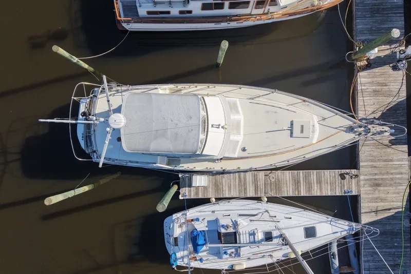Slide: The Image of Overhead view of a 1975 Gulfstar 43 Trawler docked at a marina. - 100