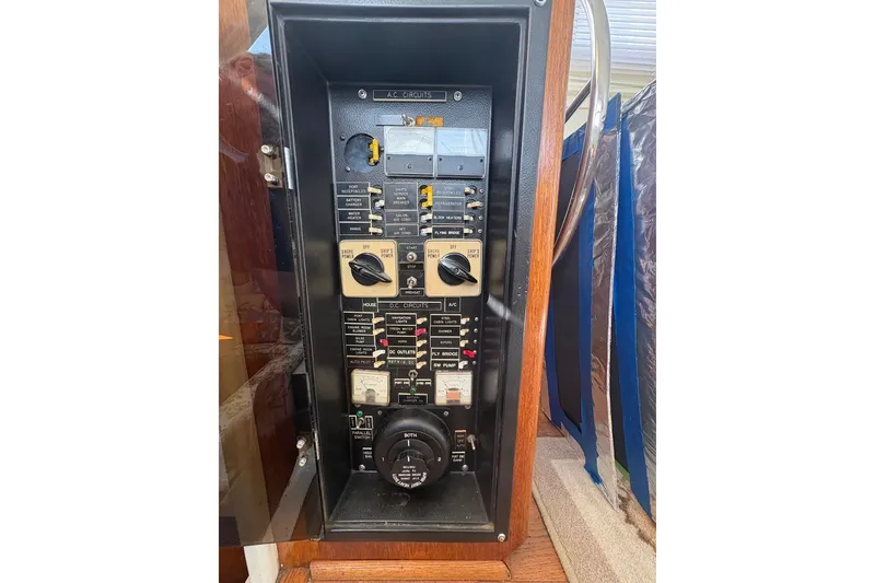 Slide: The Image of Electrical panel of a 1975 Gulfstar 43 Trawler, featuring various switches and controls. - 46