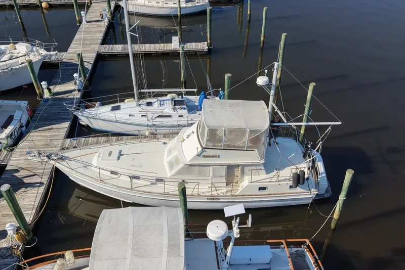 Slide: The Image of 1975 Gulfstar 43 Trawler docked at marina, aerial view. - 98