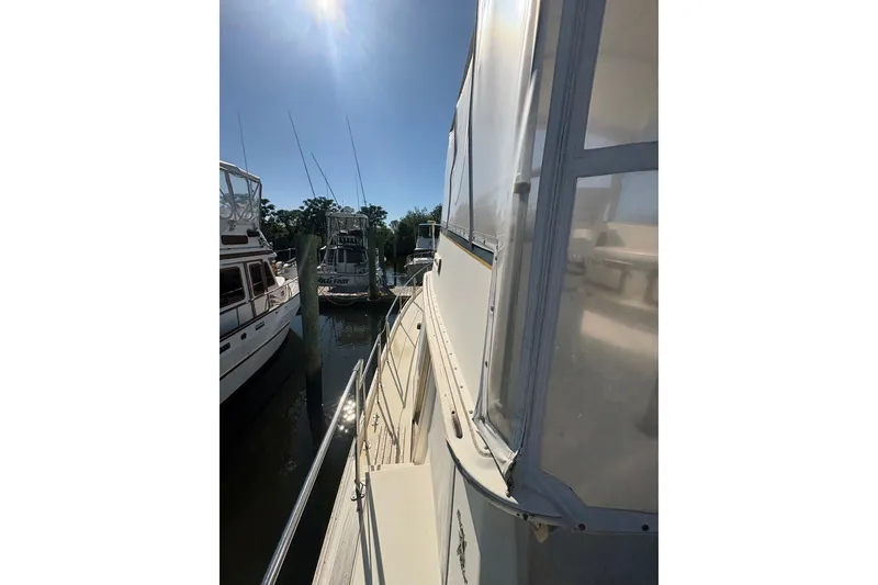Slide: The Image of 1975 Gulfstar 43 Trawler docked under clear blue sky. - 82