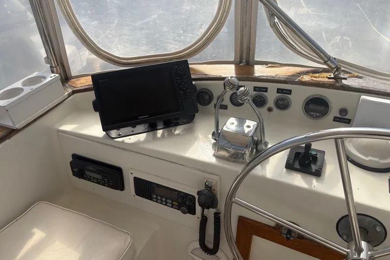 Slide: The Image of Helm of 1975 Gulfstar 43 Trawler with navigation equipment and controls. - 69