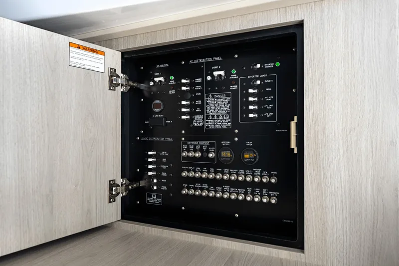 Slide: The Image of Electrical panel in a yacht with various switches and indicators. - 31