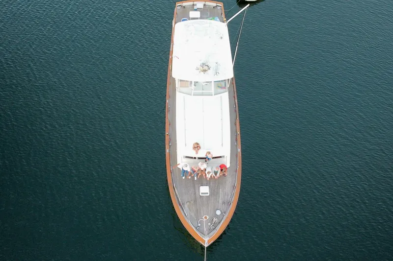 Slide: The Image of Aerial view of 1962 Chris-Craft 55 Commander yacht on calm water. - 18