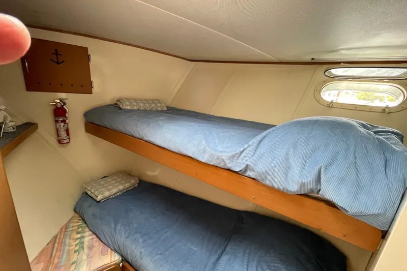 Slide: The Image of Interior cabin of 1962 Chris-Craft 55 Commander with bunk beds and nautical decor. - 22