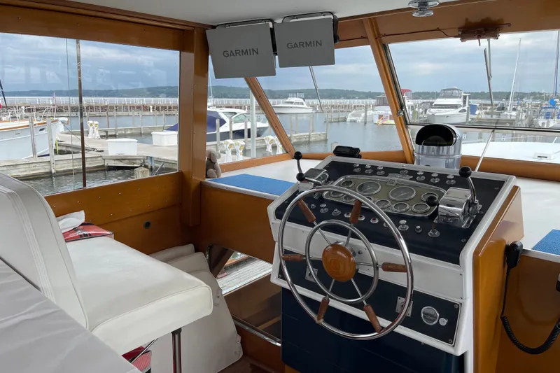 Slide: The Image of Interior view of 1962 Chris-Craft 55 Commander yacht helm with Garmin navigation system. - 21