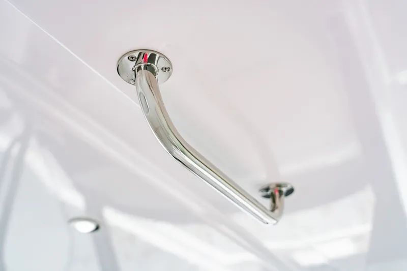 Slide: The Image of Close-up of a shiny metal handle on a white surface. - 31
