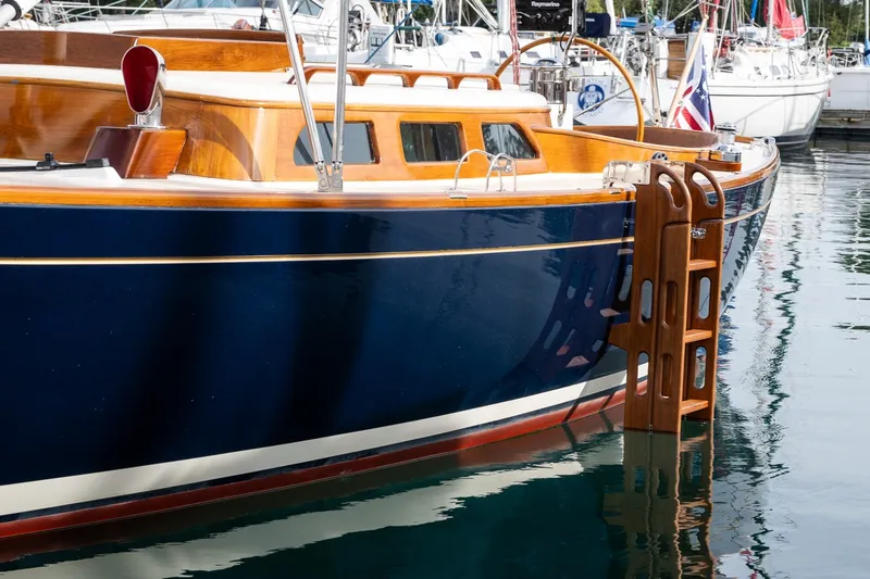 Slide: The Image of Elegant 2009 Morris M36 yacht with wooden accents docked in a marina. - 21