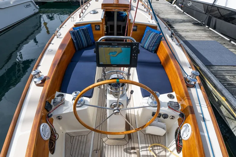 Slide: The Image of Cockpit of a 2009 Morris M36 sailboat with wooden accents and navigation equipment. - 31