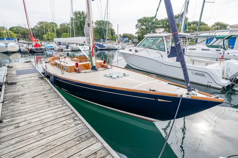 Slide: The Image of Sailboat Morris M36, 2009 model, docked at marina with surrounding boats. - 6
