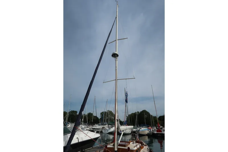 Slide: The Image of Sailboat in marina, Morris M36, 2009 model, with tall mast and clear sky. - 7