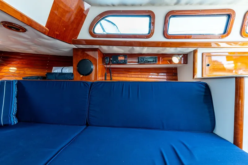Slide: The Image of Luxurious interior of 2009 Morris M36 yacht with blue seating and polished wood finish. - 40