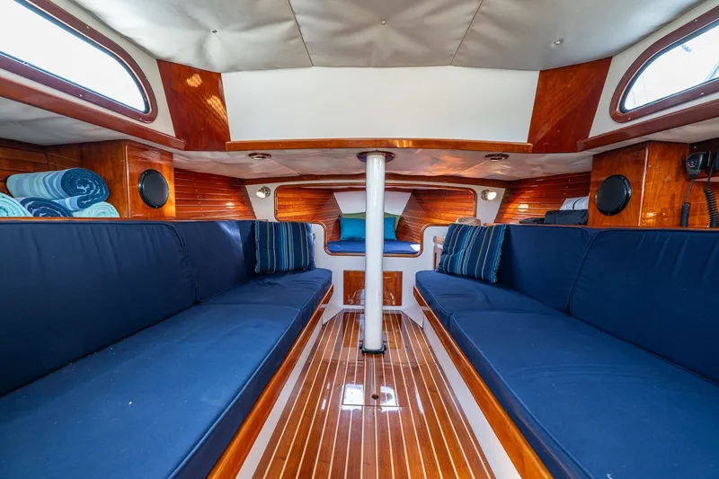 Slide: The Image of Luxurious interior of 2009 Morris M36 sailboat with blue seating and polished wood finish. - 37