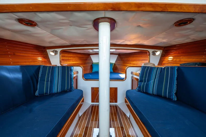Slide: The Image of Interior of 2009 Morris M36 sailboat with blue seating and wooden accents. - 41