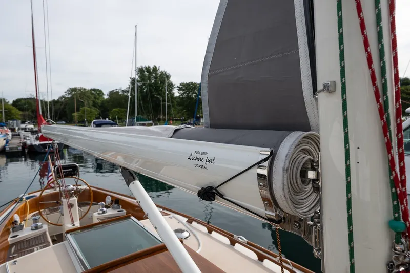 Slide: The Image of 2009 Morris M36 sailboat with rolled sail, docked in a marina. - 13