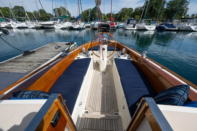 Slide: The Image of Cockpit view of 2009 Morris M36 sailboat docked at a marina with surrounding yachts. - 35