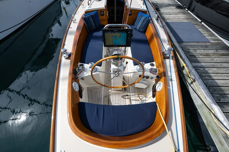 Slide: The Image of Cockpit of a 2009 Morris M36 sailboat with wooden accents and navigation equipment. - 30