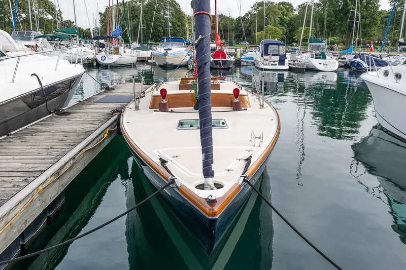 Slide: The Image of Sailboat docked in marina, Morris M36, 2009 model, surrounded by other boats. - 4