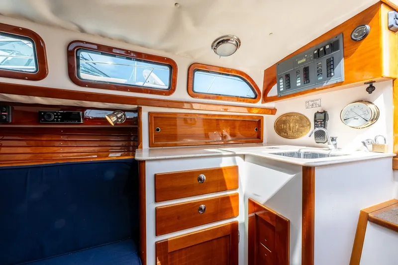 Slide: The Image of Interior of a 2009 Morris M36 yacht with polished wood cabinetry and modern amenities. - 45