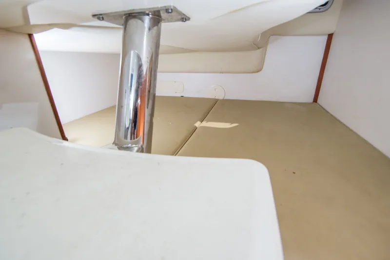 Slide: The Image of Interior cabin view of a 2005 Boston Whaler 305 Conquest boat. - 13