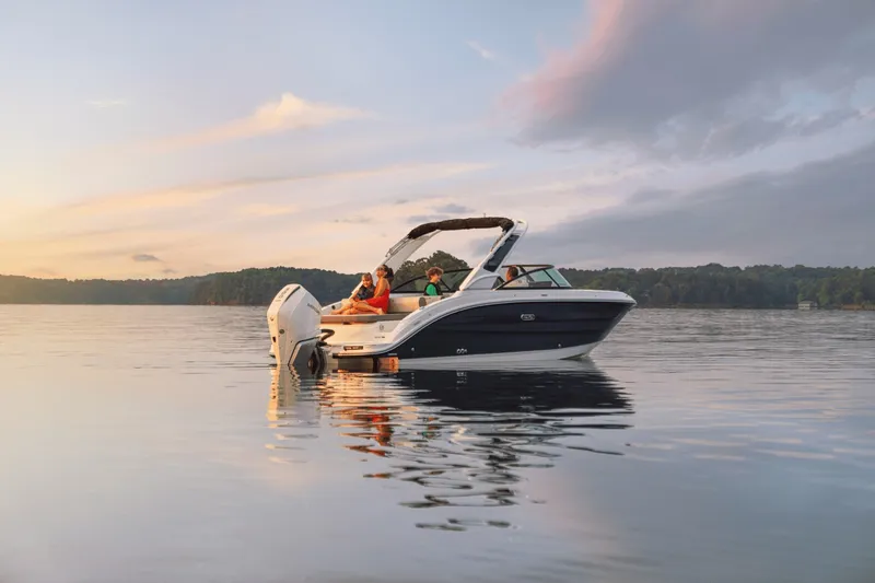 Slide: The Image of A 2027 Sea Ray SDX 250 Outboard on calm water at sunset. - 35