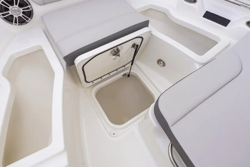 Slide: The Image of Interior of the 2027 Sea Ray SDX 250 Outboard with storage and seating areas. - 9