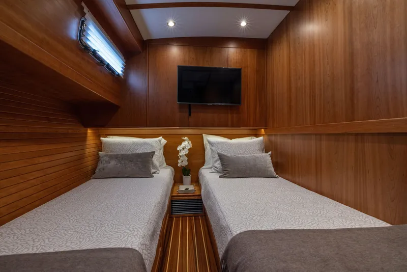 Slide: The Image of Luxurious twin cabin interior of 2026 Sabre 58 Salon Express yacht. - 22