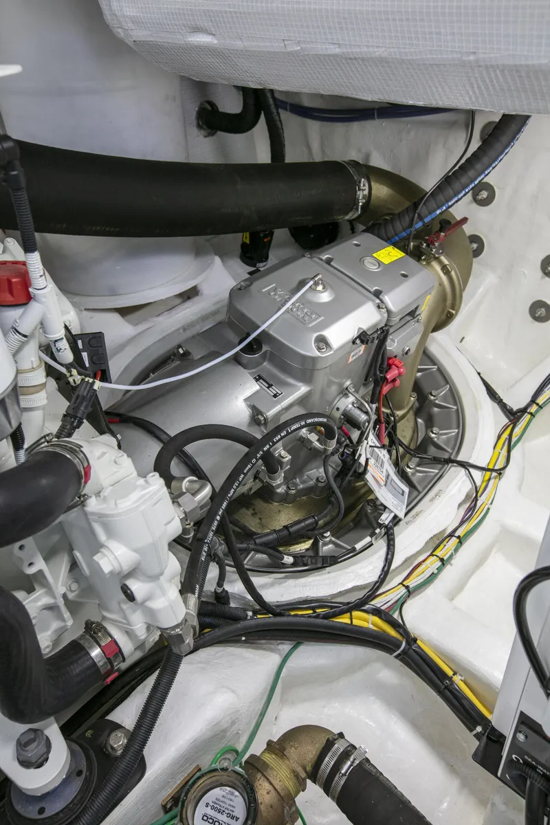 Slide: The Image of Engine room of 2026 Sabre 58 Salon Express with visible mechanical components and wiring. - 28