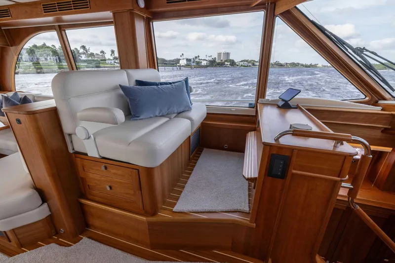 Slide: The Image of Luxurious interior of 2026 Sabre 58 Salon Express yacht with plush seating and scenic view. - 13