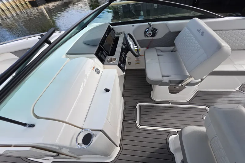 Slide: The Image of 2024 Sea Ray SDX 250 boat interior with modern helm and seating. - 10