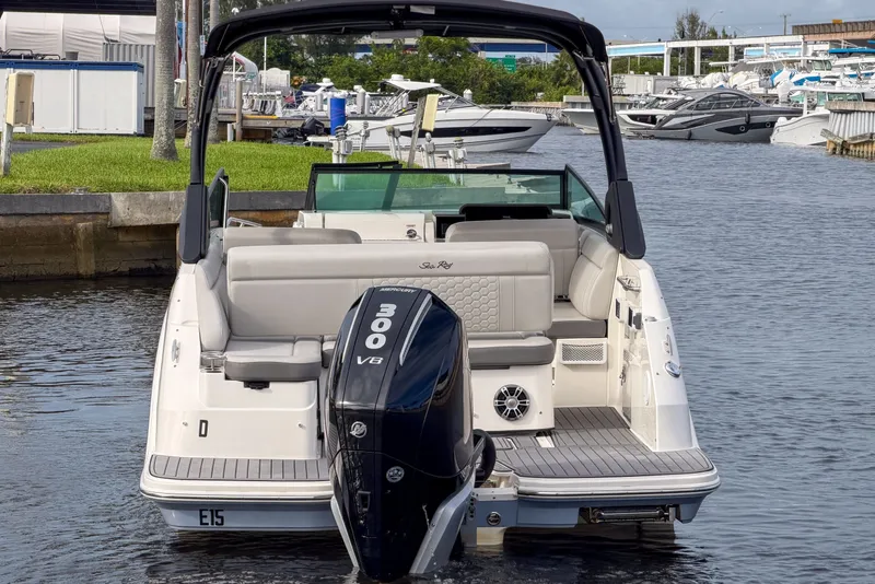 Slide: The Image of 2024 Sea Ray SDX 250 boat with 300 V8 engine, docked in a marina. - 7
