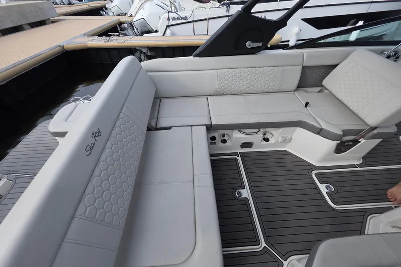 Slide: The Image of 2024 Sea Ray SDX 250 boat interior with luxurious seating and modern design. - 15