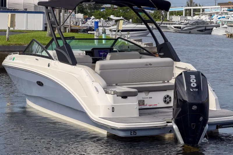 Slide: The Image of 2024 Sea Ray SDX 250 boat with Mercury 300 V8 engine docked at marina. - 6