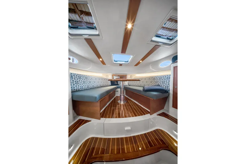 Slide: The Image of Luxurious interior of 2023 Hinckley Sport Boat 40 X with elegant wood finishes. - 14