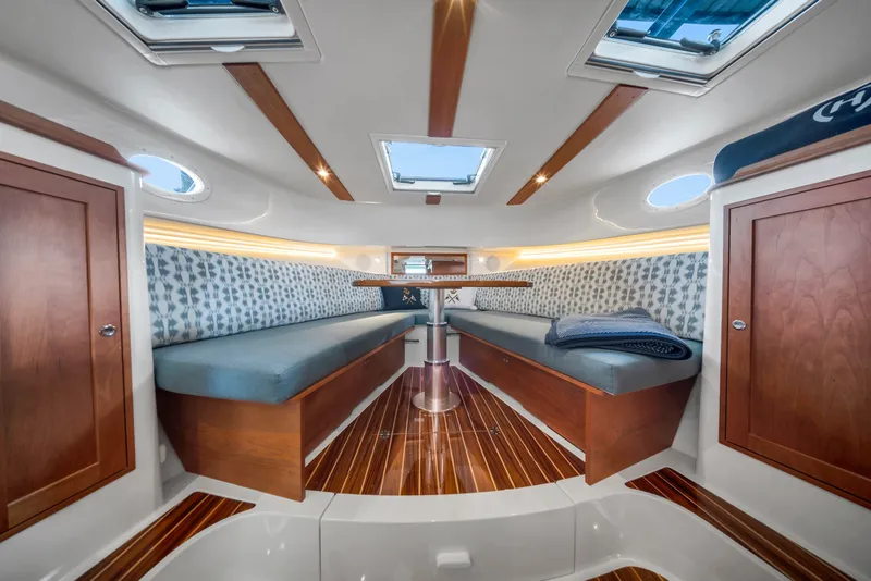 Slide: The Image of Luxurious interior of 2023 Hinckley Sport Boat 40 X with elegant wood finishes. - 15