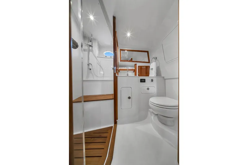 Slide: The Image of Luxurious bathroom interior of 2023 Hinckley Sport Boat 40 X with modern fixtures. - 18