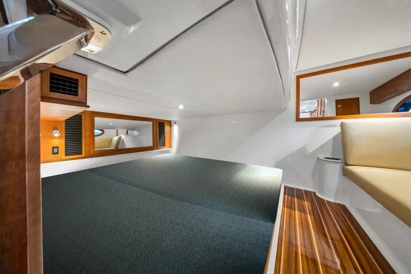 Slide: The Image of Luxurious interior of 2023 Hinckley Sport Boat 40 X with wood accents and seating. - 17