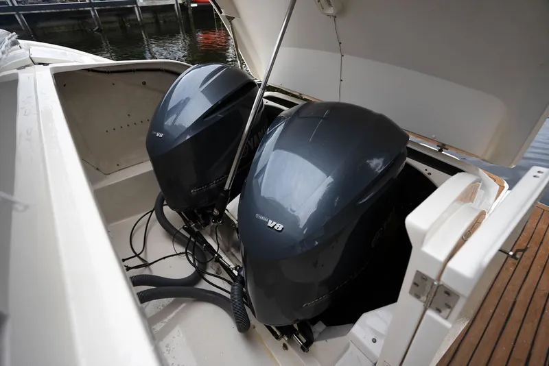 Slide: The Image of Two powerful V8 engines are mounted at the stern of a 2013 Pursuit SC 365i Sport Coupe. - 34