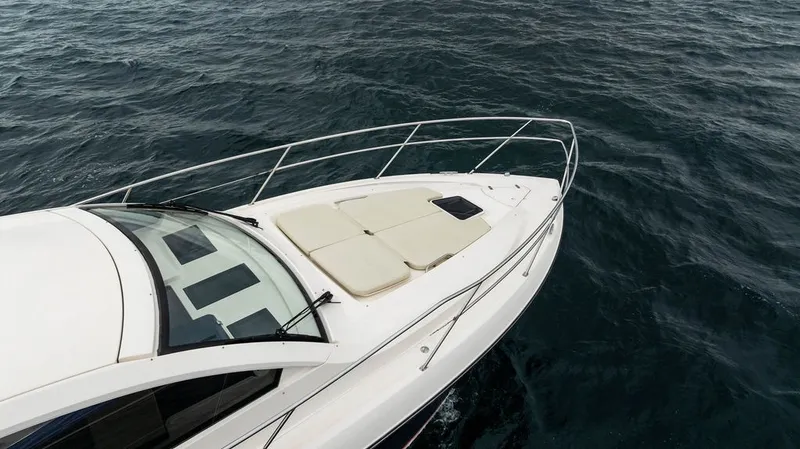 Slide: The Image of The 2013 Pursuit SC 365i Sport Coupe features a sleek design with a spacious foredeck. - 30