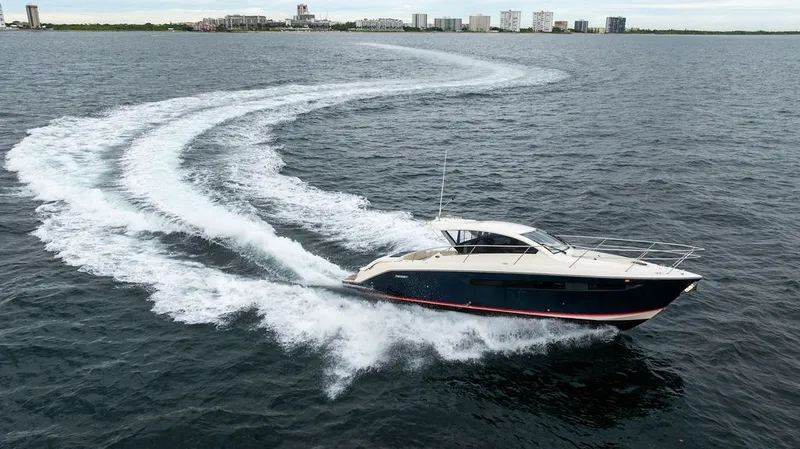 Slide: The Image of A 2013 Pursuit SC 365i Sport Coupe speeds across the water, leaving a white wake. - 17