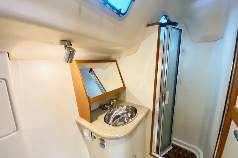 Slide: The Image of Compact bathroom in 2008 Hunter 41 Aft Cockpit yacht with sink and shower. - 27