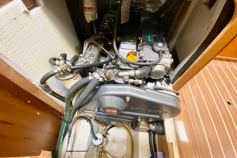 Slide: The Image of Engine compartment of a 2008 Hunter 41 Aft Cockpit sailboat, featuring a Yanmar engine. - 59
