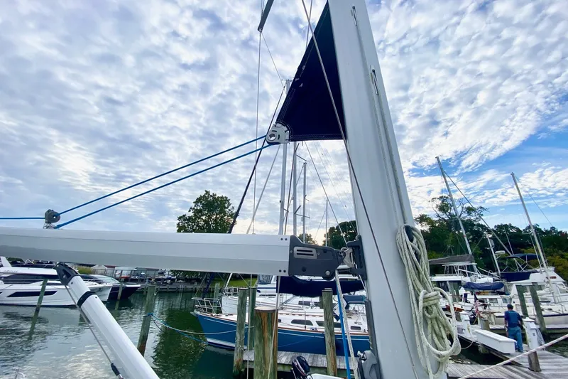 Slide: The Image of Sailboat mast and rigging of 2008 Hunter 41 Aft Cockpit at marina under cloudy sky. - 41